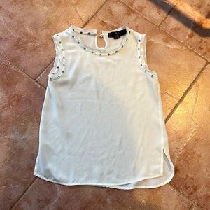 Sheer white sleeveless blouse